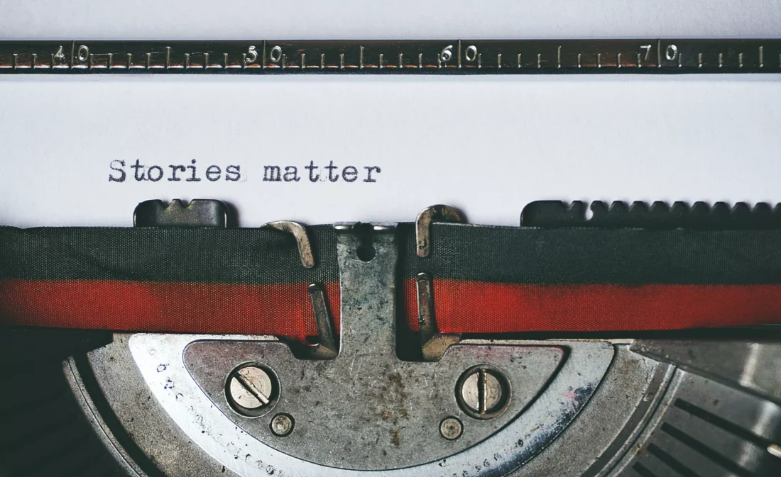 Guest Posting Policy at New Horizons Medical. Image of a typewriter with text "stories matter" by suzy-hazelwood from pexels